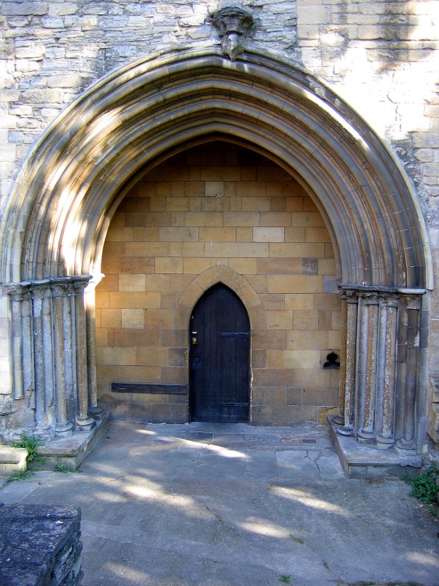 Door Dwarfed by its Archway Door Dwarfed by its Archway