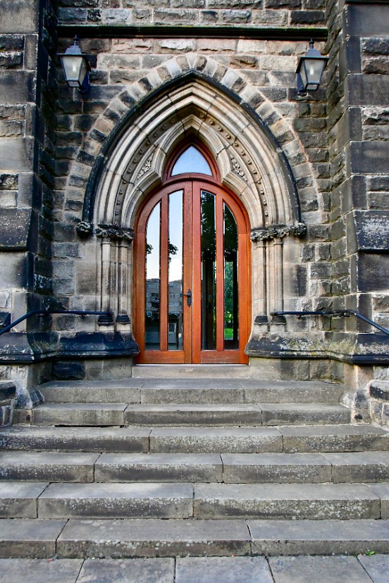 Modern Looking Door Inside Classic Archway